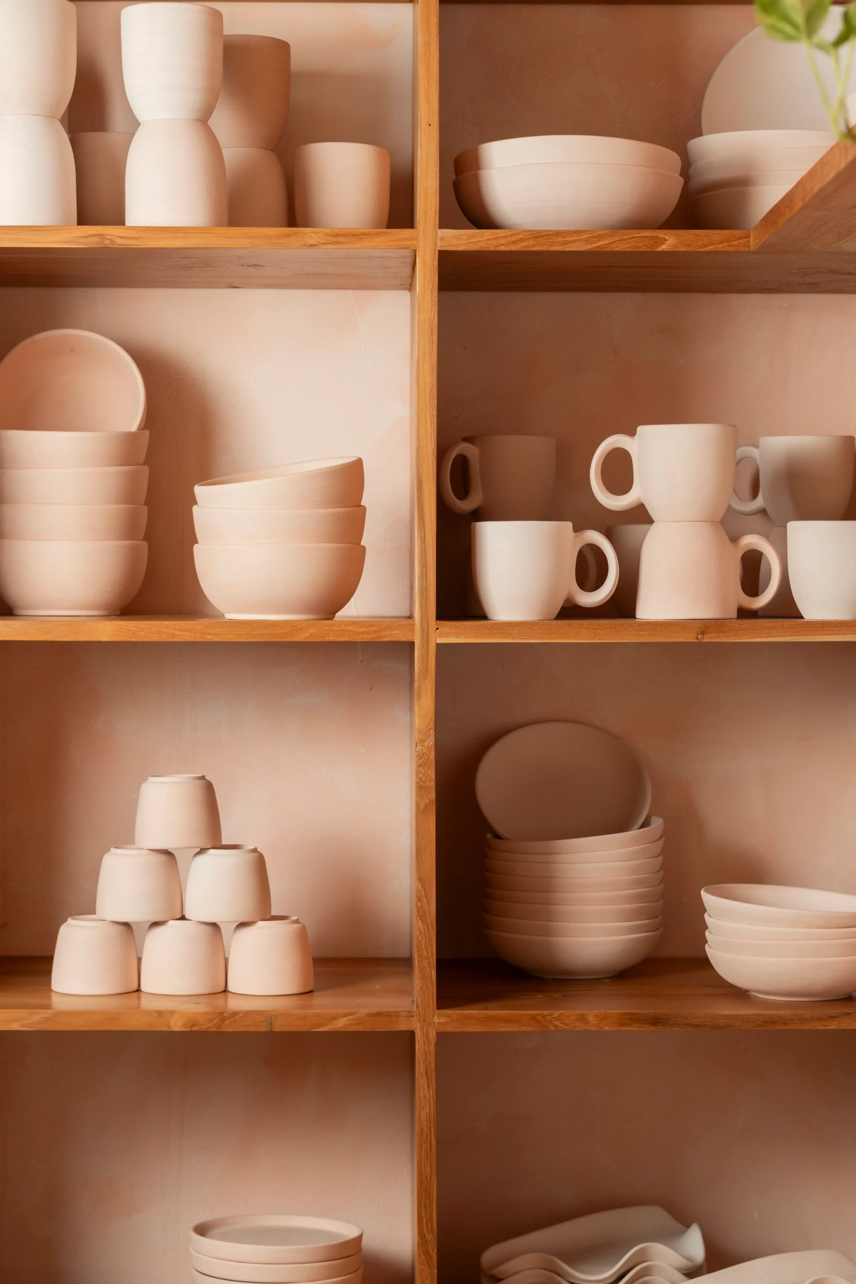 ceramic shelf with mugs, bowls, espresso cups and jewelry trays