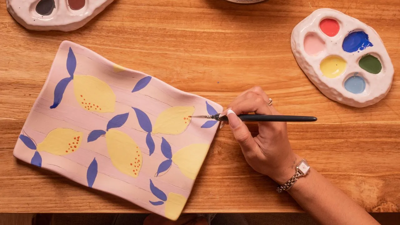 Hand painting ceramic plate at klay bar Canggu, creative and unusual activity in Canggu