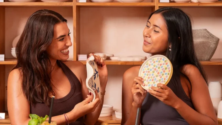 Women enjoying pottery painting at klay bar in Canggu, creative activity idea for one day in Canggu.