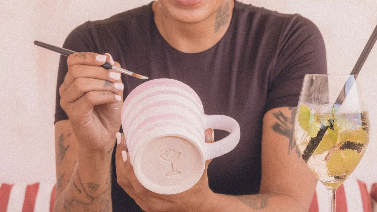 Hand painting ceramic mug at klay bar, fun creative activity in Canggu