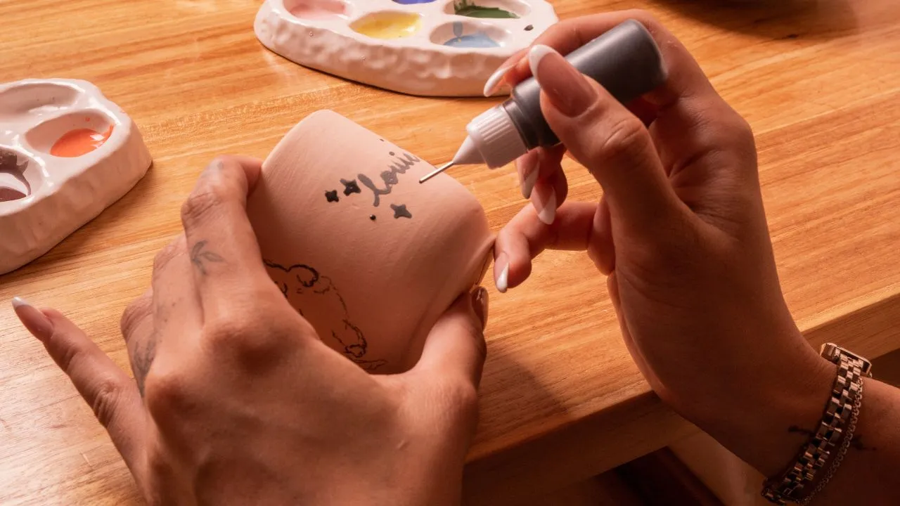 Hand painting ceramic cup at klay bar Canggu, creative thing to do in Canggu for one day